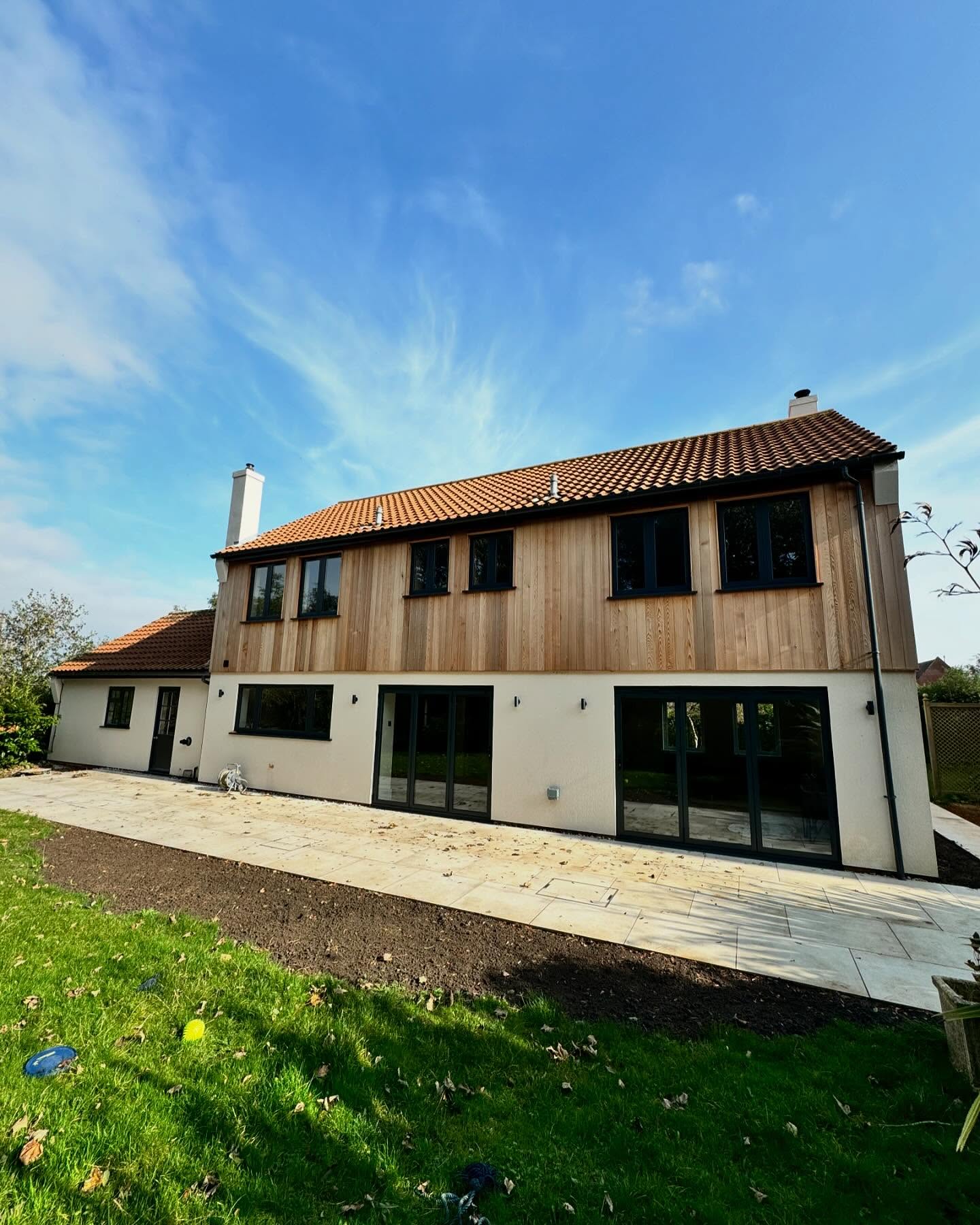 All elevations in cedar cladding and render below.
